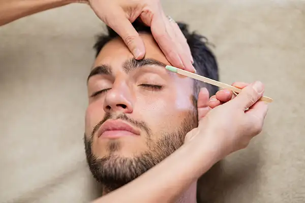 Eyebrow Waxing on a Man