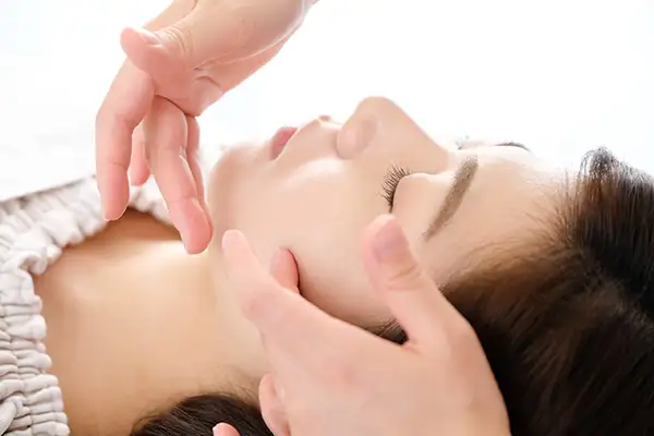Woman receiving a facial massage